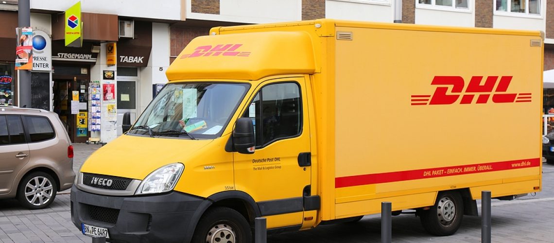 GELSENKIRCHEN, GERMANY - SEPTEMBER 17, 2020: DHL courier delivery van in Germany. DHL is part of German national mail service - Deutsche Post.